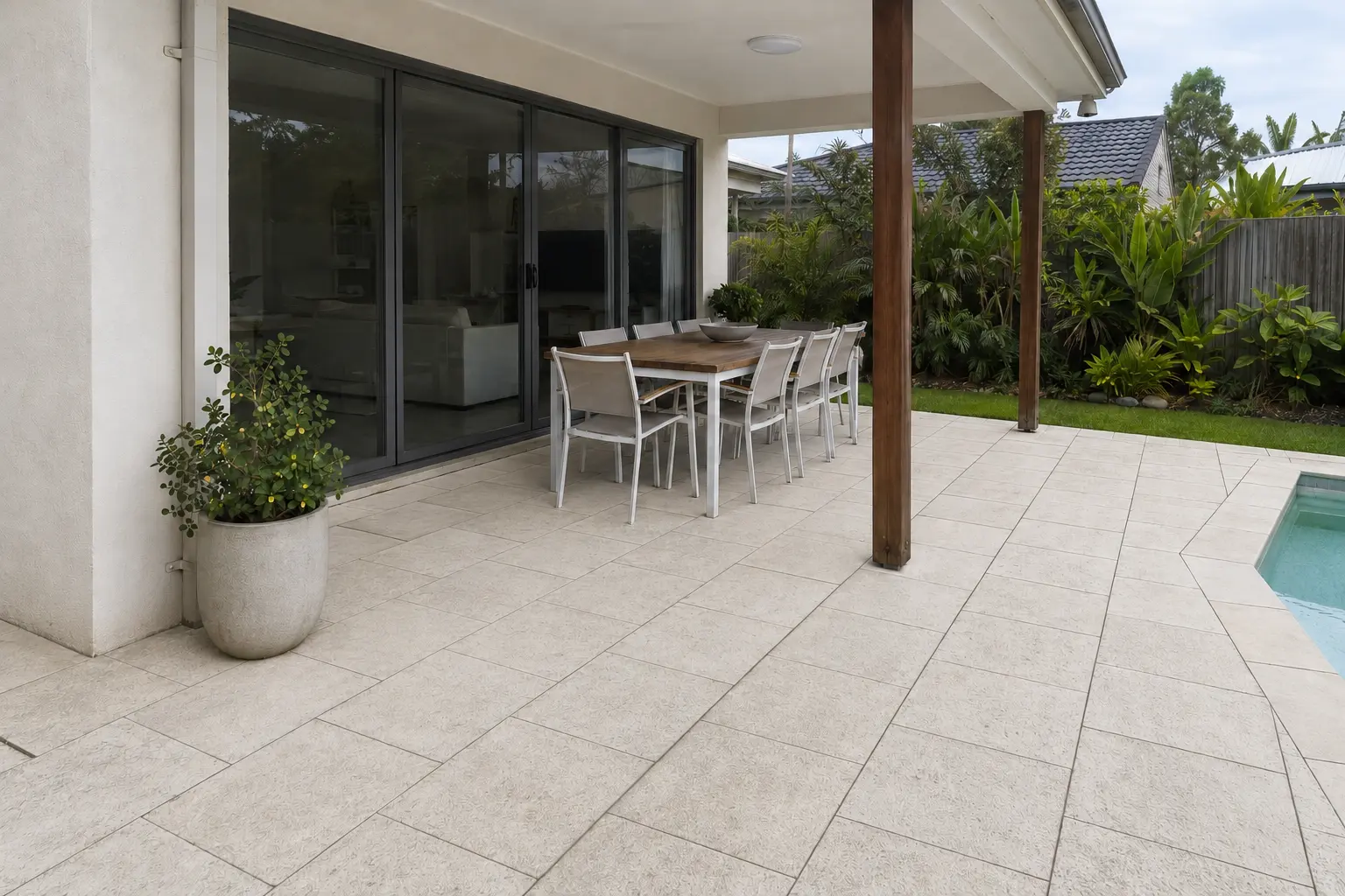 The same covered outdoor patio after the paving was cleaned